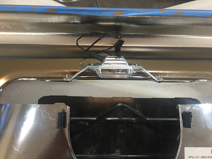 License plate gas door